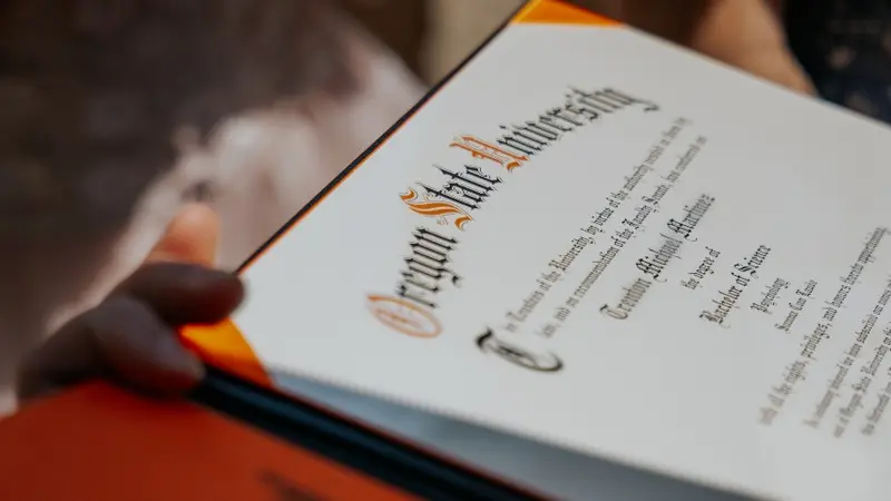 Diploma at commencement in diploma cover