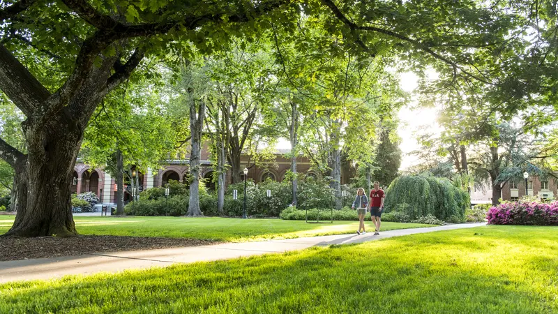 campus path with two students walking