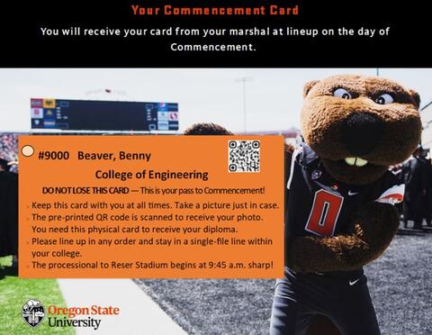 Benny holding a commencement card at commencement